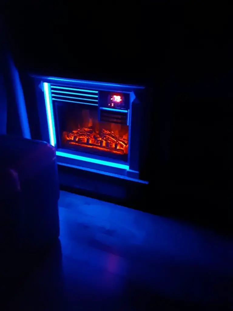 Neon lights from our small electric fireplace in the Itasca class C RV. RV interior updates