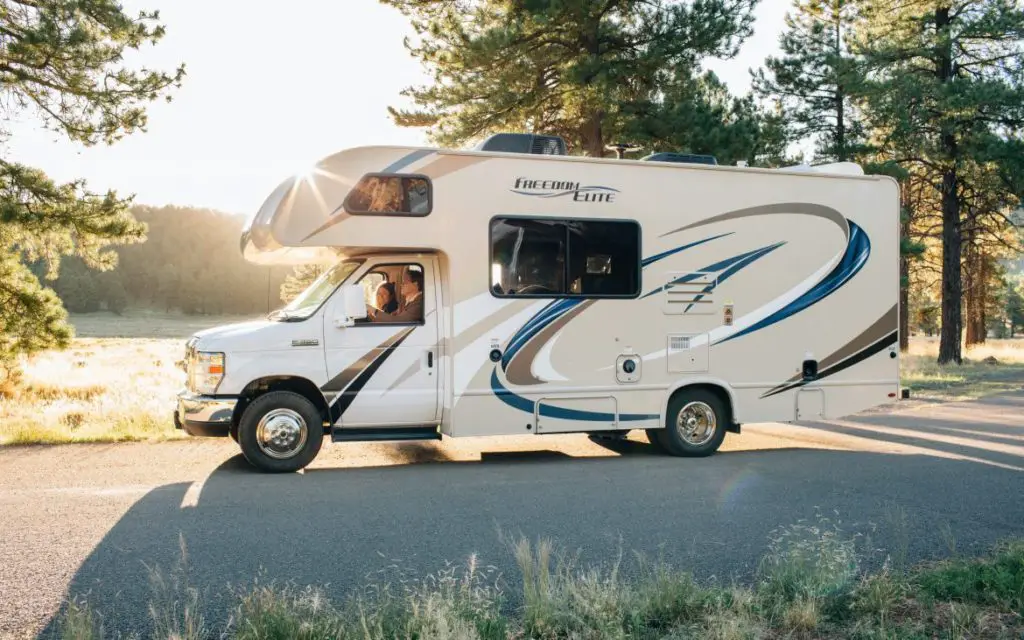 RV smells- How to find, eliminate and prevent them from ruining your adventure. couple driving in new RV.